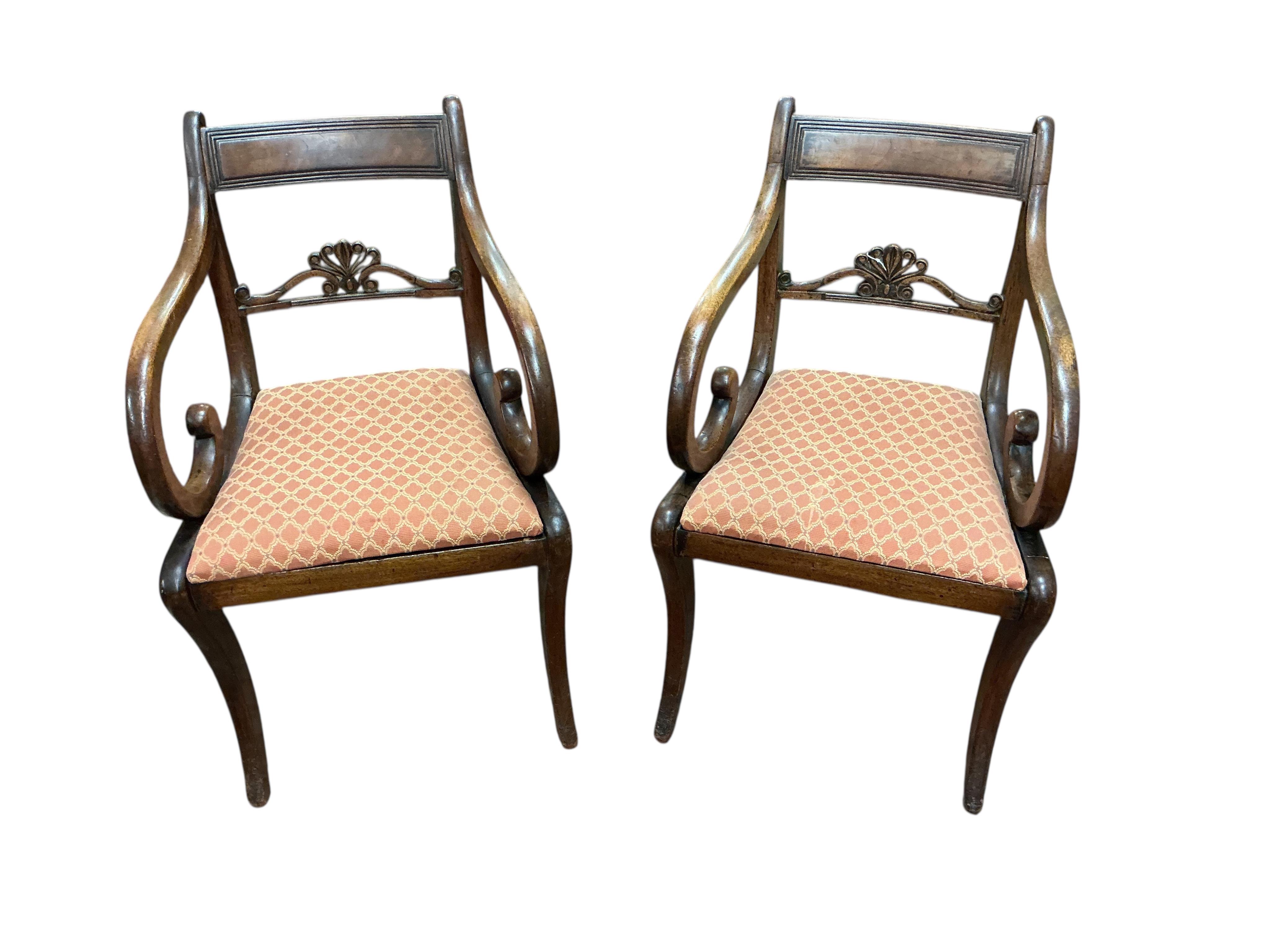 A set of eight Regency mahogany dining chairs, two with arms.